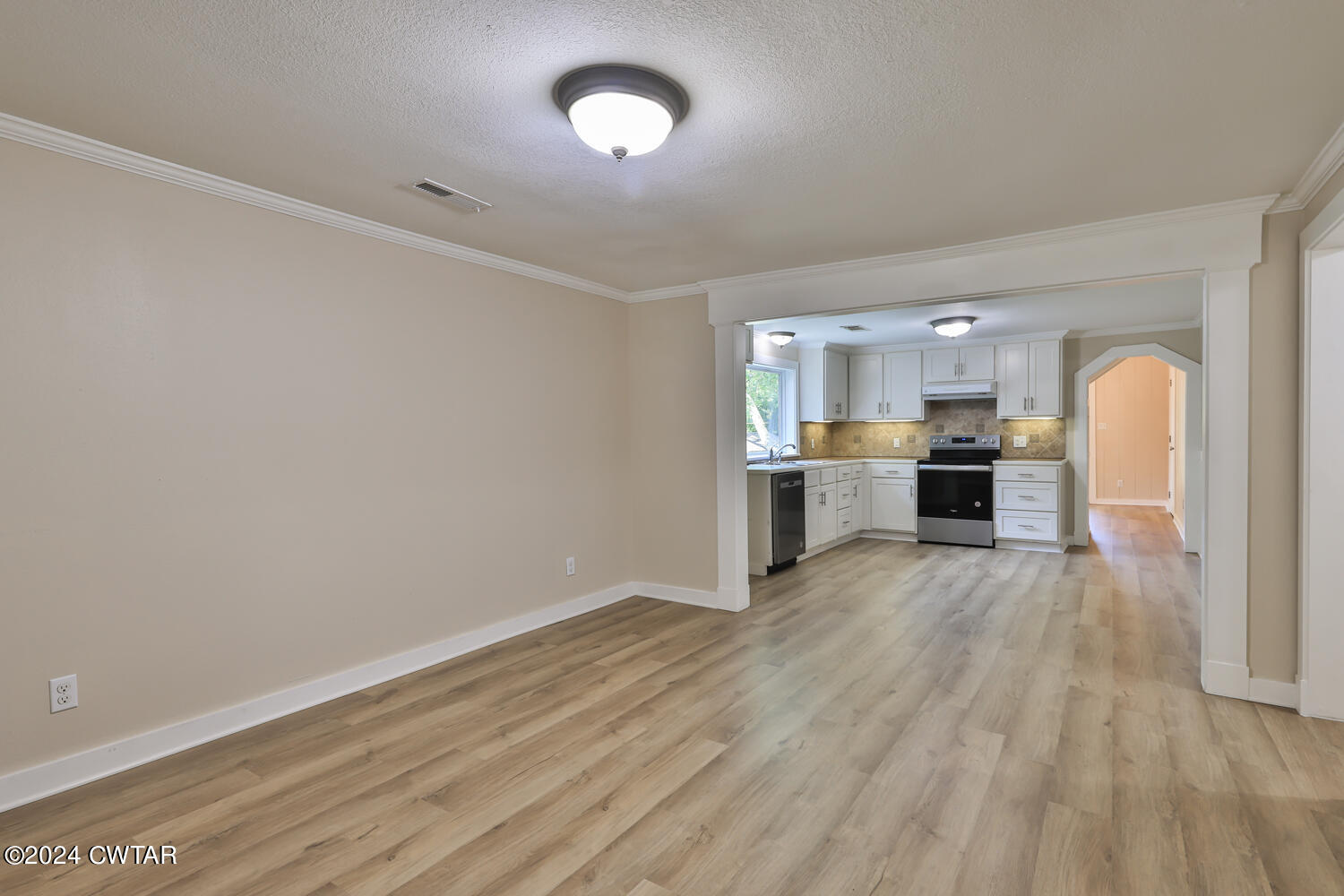 246 Thomas Street Dyer, TN 38330 - Photo 7 of 19 a view of a kitchen with a sink and a stove top oven