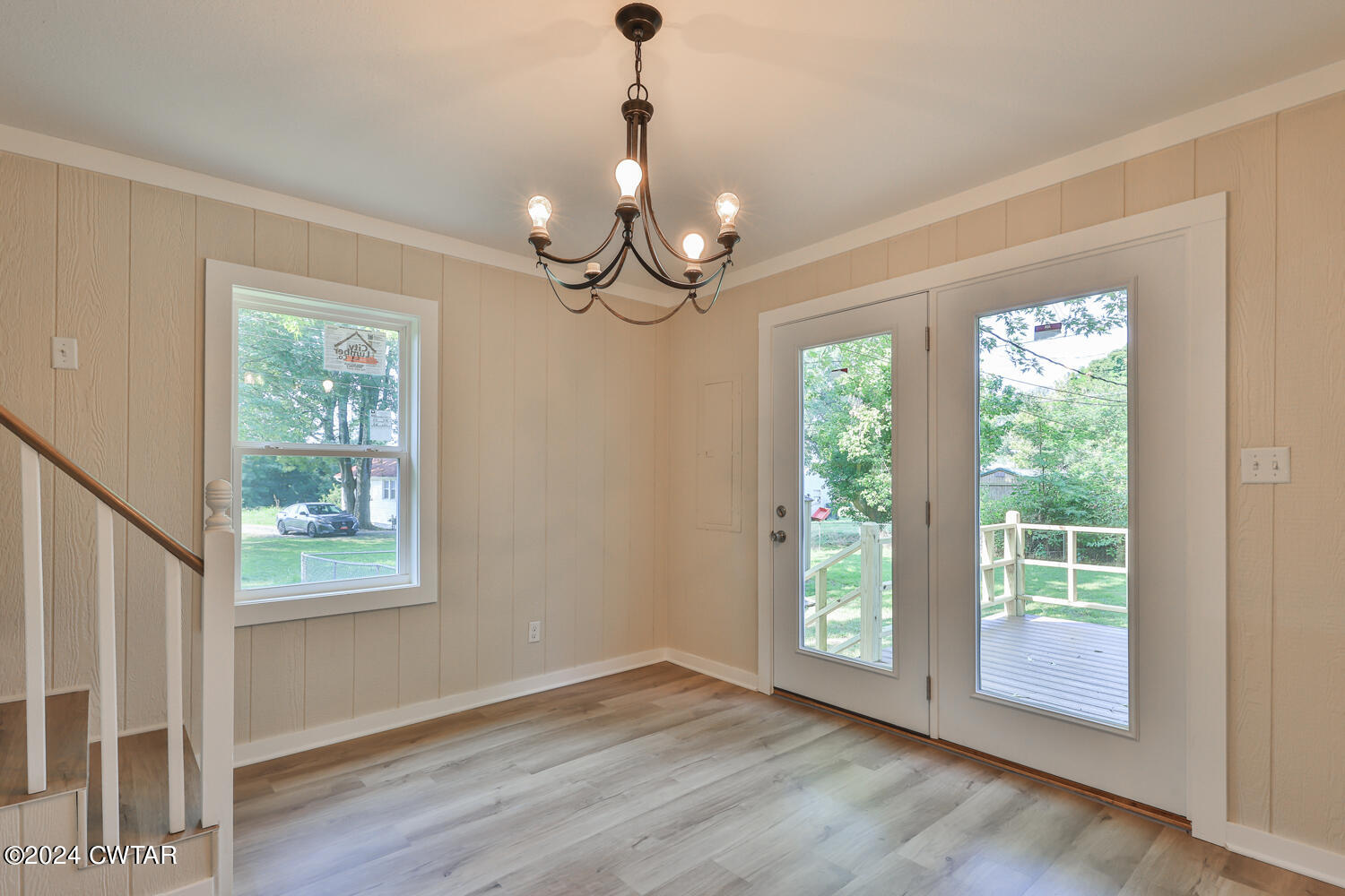 246 Thomas Street Dyer, TN 38330 - Photo 10 of 19 a view of an empty room with wooden floor and a window