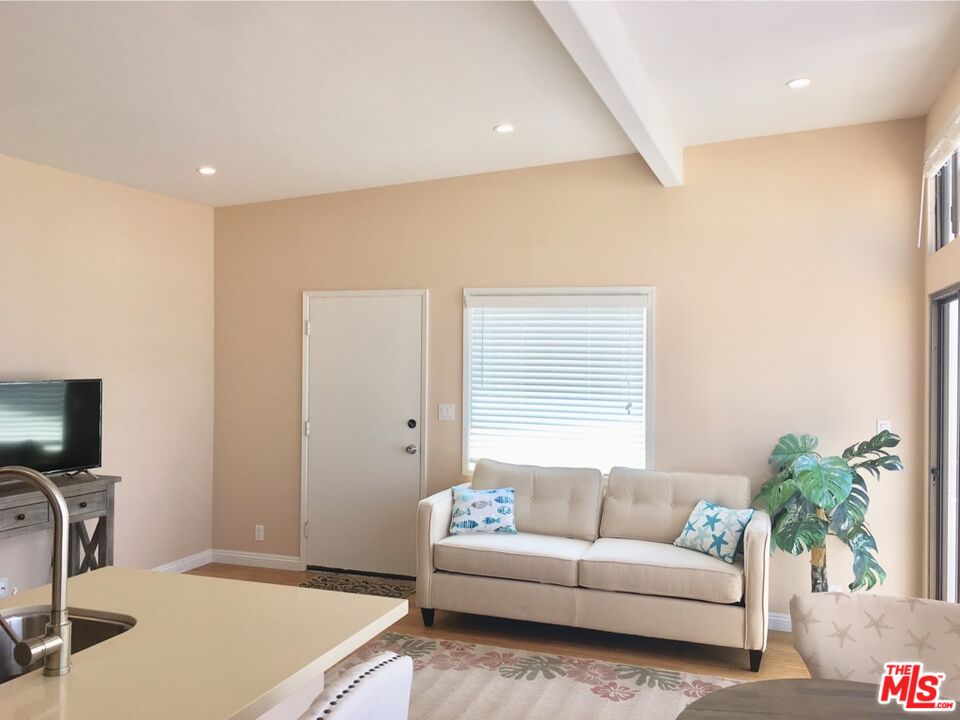 25164 Malibu Road, Unit D Malibu, CA 90265 - Photo 11 of 24 a living room with furniture and a flat screen tv