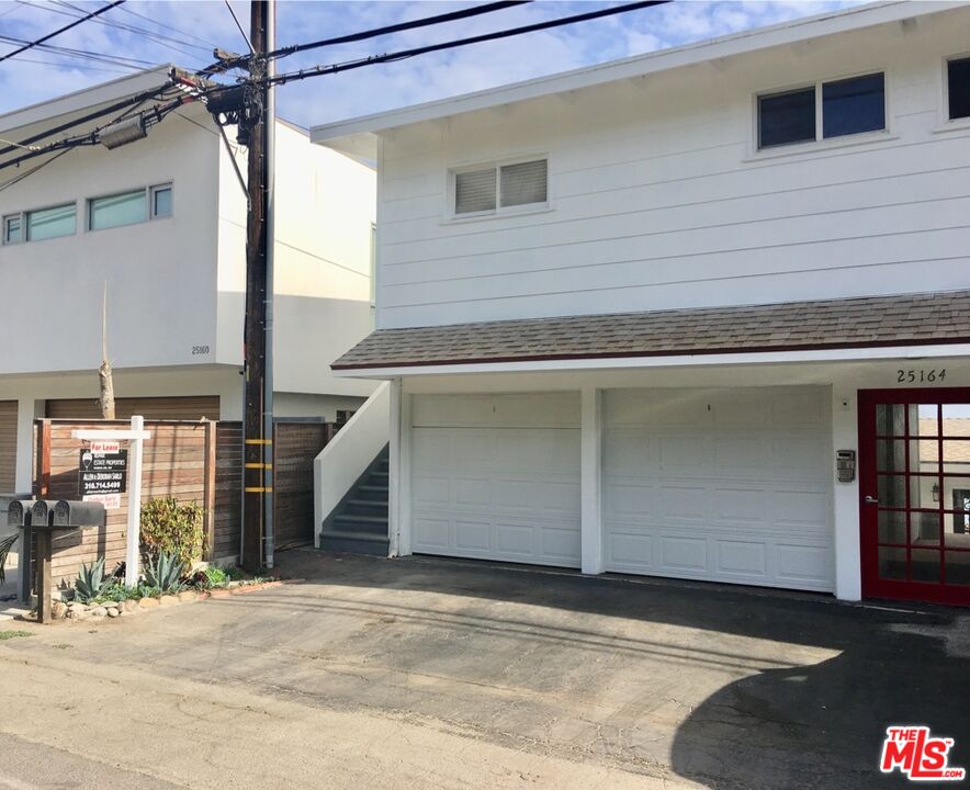 25164 Malibu Road, Unit D Malibu, CA 90265 - Photo 20 of 24 a front view of a house with a garage