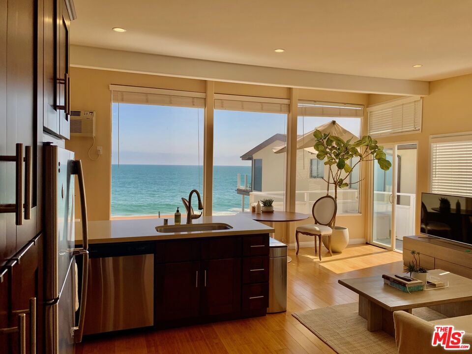 25164 Malibu Road, Unit D Malibu, CA 90265 - Photo 24 of 24 a living room with large window and furniture