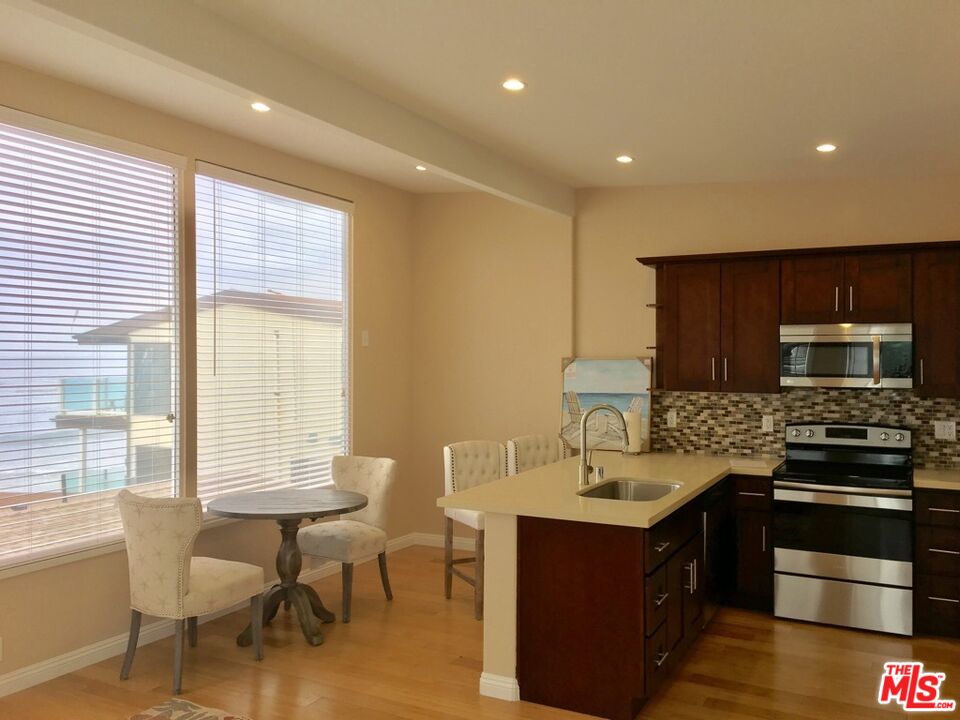 25164 Malibu Road, Unit D Malibu, CA 90265 - Photo 3 of 24 a kitchen with a stove and a sink