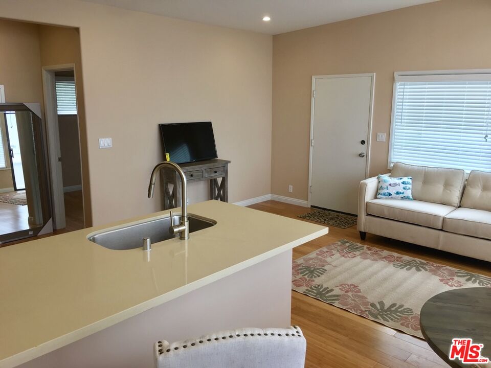 25164 Malibu Road, Unit D Malibu, CA 90265 - Photo 9 of 24 a living room with furniture and a flat screen tv