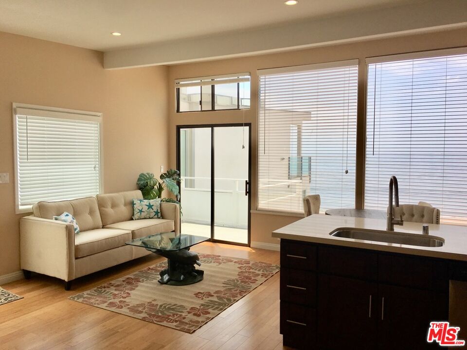 25164 Malibu Road, Unit D Malibu, CA 90265 - Photo 10 of 24 a living room with furniture and a large window