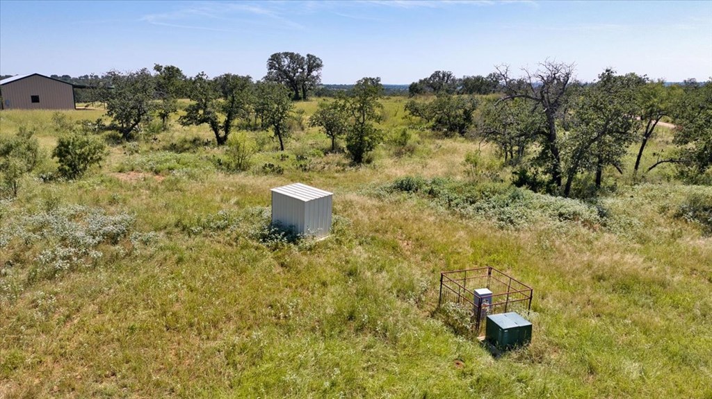 4773 Behrens School Road Fredonia, TX 76842 - Photo 14 of 27 a view of a dry yard with trees
