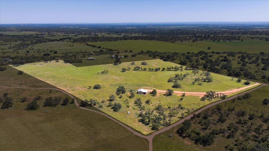 4773 Behrens School Road Fredonia, TX 76842 - Photo 15 of 27 an aerial view of a swimming pool with a yard