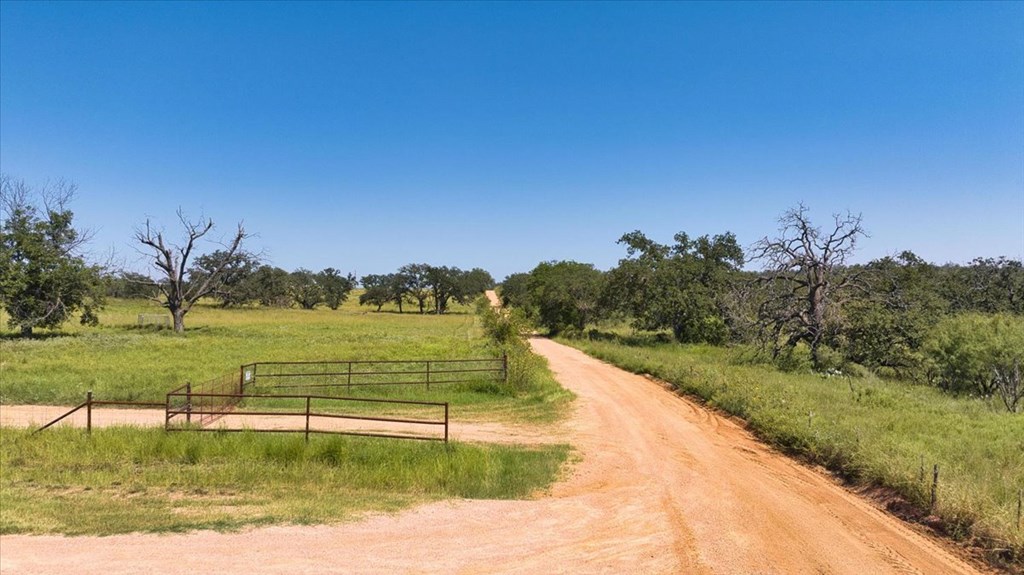 4773 Behrens School Road Fredonia, TX 76842 - Photo 4 of 27 a view of a lake with houses in the background