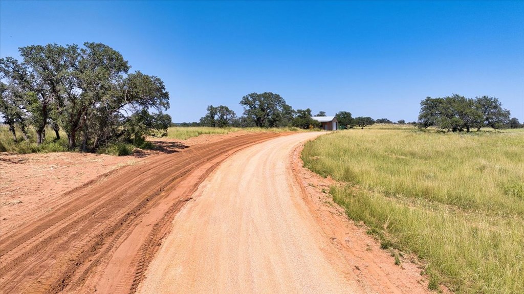 4773 Behrens School Road Fredonia, TX 76842 - Photo 5 of 27 a view of a swimming pool with a yard