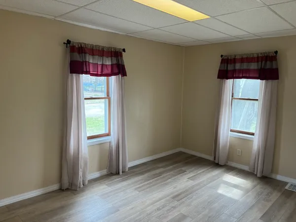 a view of closet with wooden floor