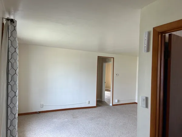 a view of an empty room with a window