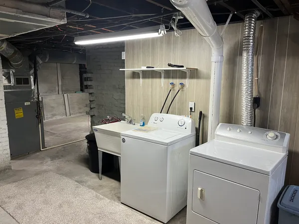 a bathroom with a bathtub and shower