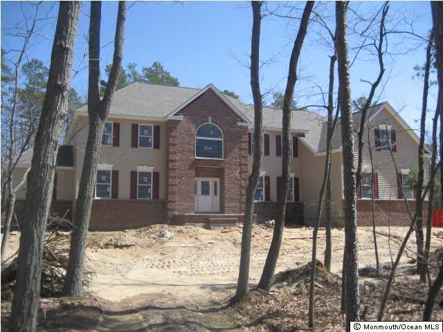 1 Brookside Road Millstone Township, NJ 08510 - Photo 2 of 3 a front view of a house with a yard
