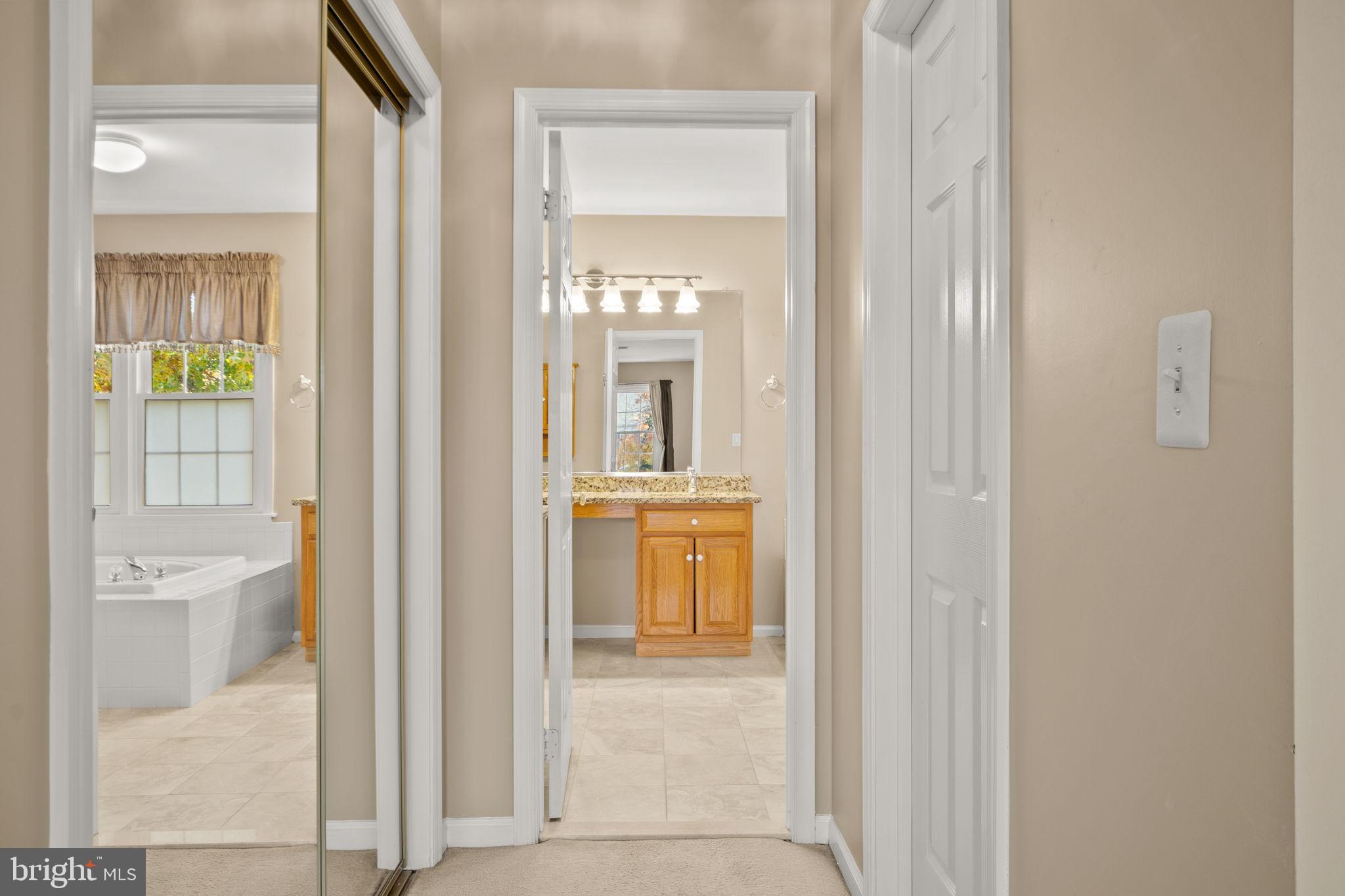 9615 Linden Wood Road Manassas, VA 20111 - Photo 16 of 37 Inviting hallway leading to serene spaces.