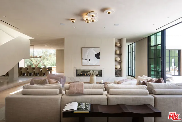 a large kitchen with lots of counter space and dining table