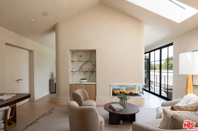 a bedroom with a large bed and a large window