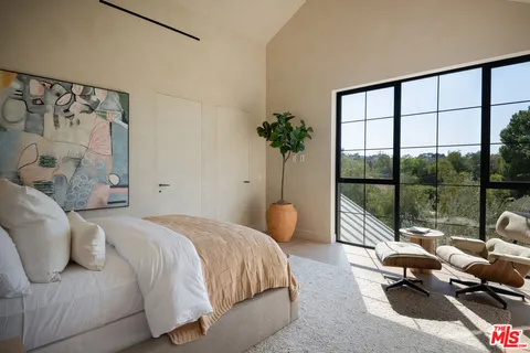 a view of backyard of the house along with seating space