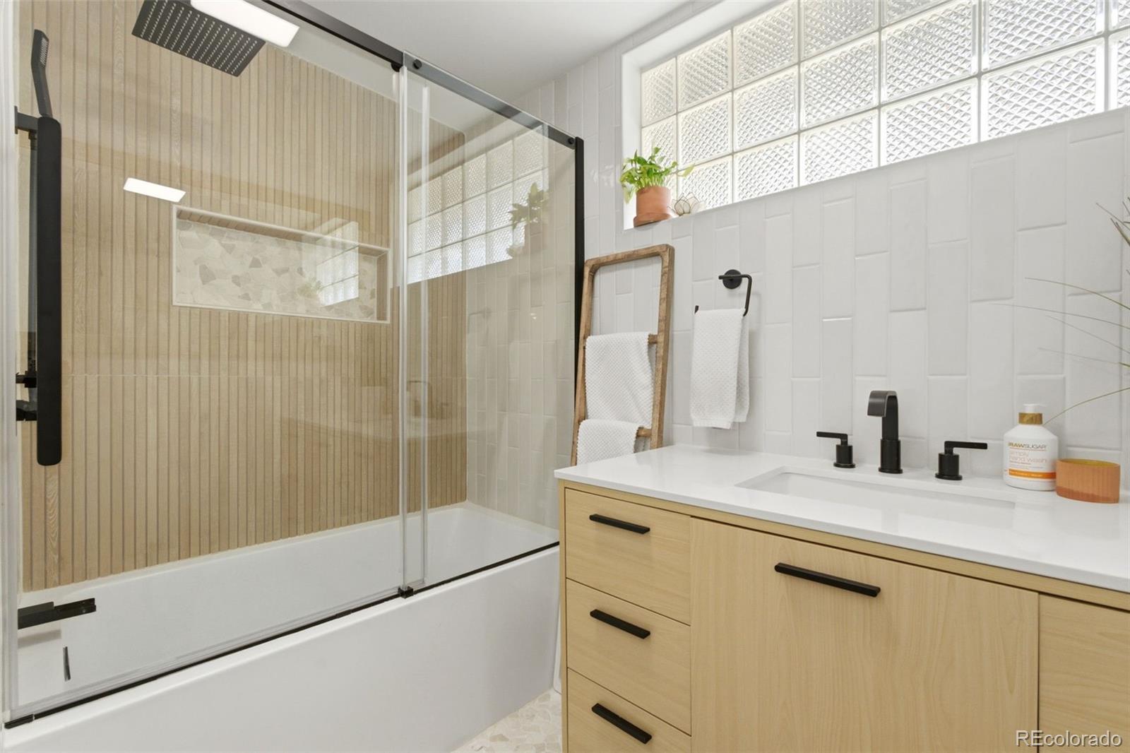 999 South Fillmore Way Denver, CO 80209 - Photo 16 of 37 a bathroom with a sink and a mirror