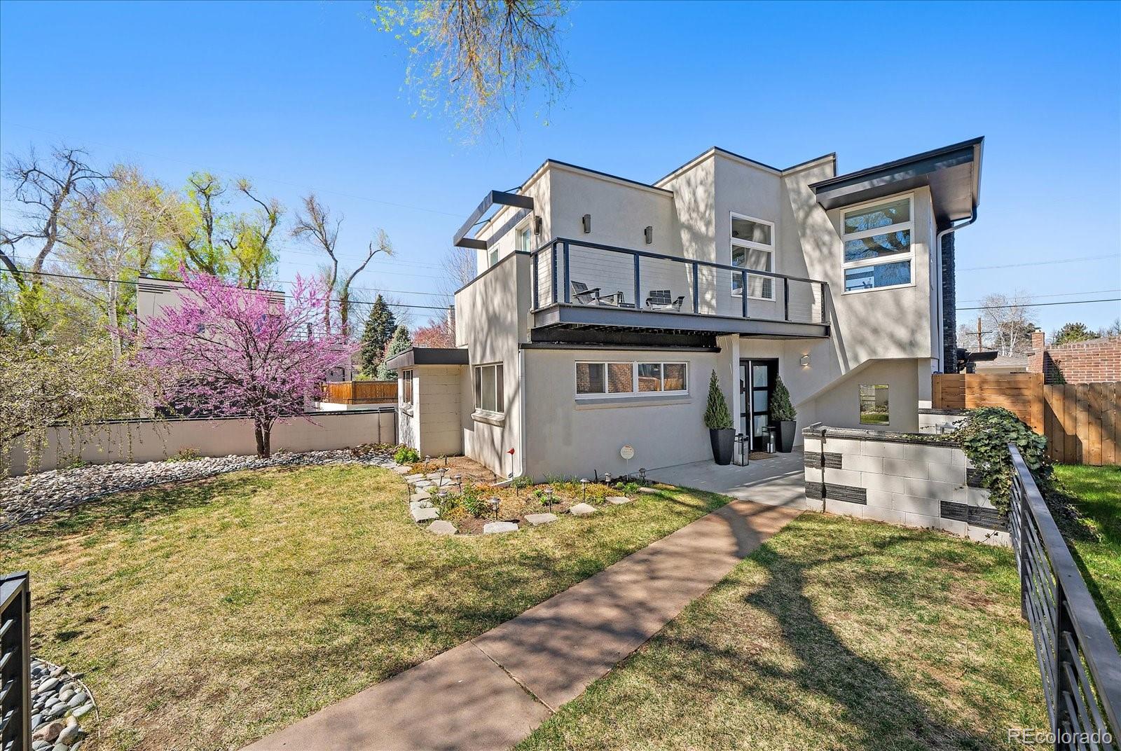 999 South Fillmore Way Denver, CO 80209 - Photo 2 of 37 a view of a house with a yard
