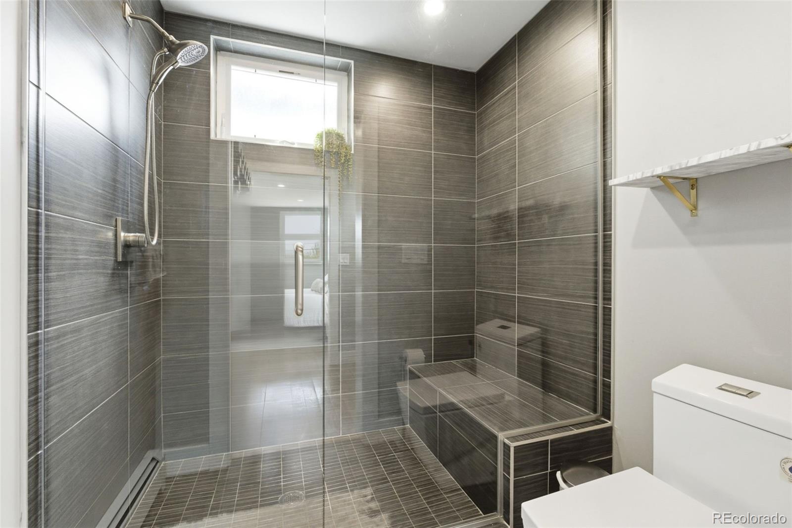 999 South Fillmore Way Denver, CO 80209 - Photo 29 of 37 a bathroom with a toilet and a shower