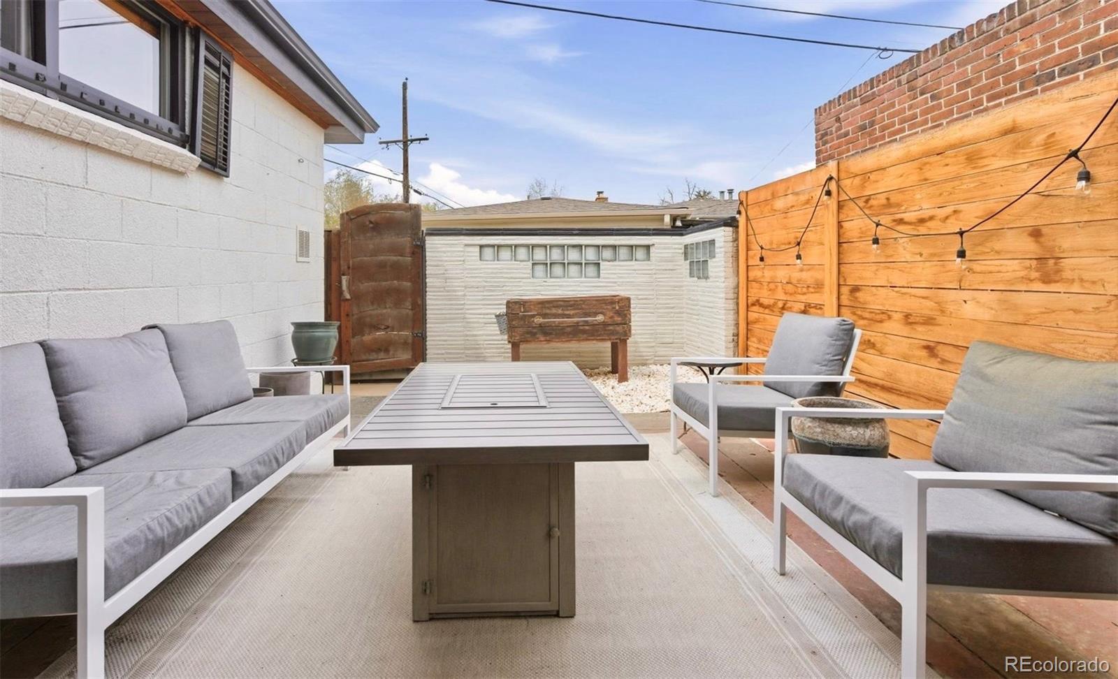 999 South Fillmore Way Denver, CO 80209 - Photo 33 of 37 a view of a terrace with furniture and a window