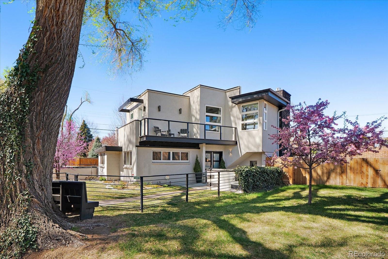 999 South Fillmore Way Denver, CO 80209 - Photo 35 of 37 a view of a house with a yard