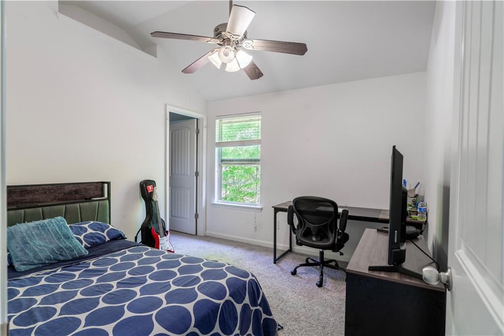5555 Hedge Brook Drive Cumming, GA 30028 - Photo 12 of 15 a bedroom with a bed and a window