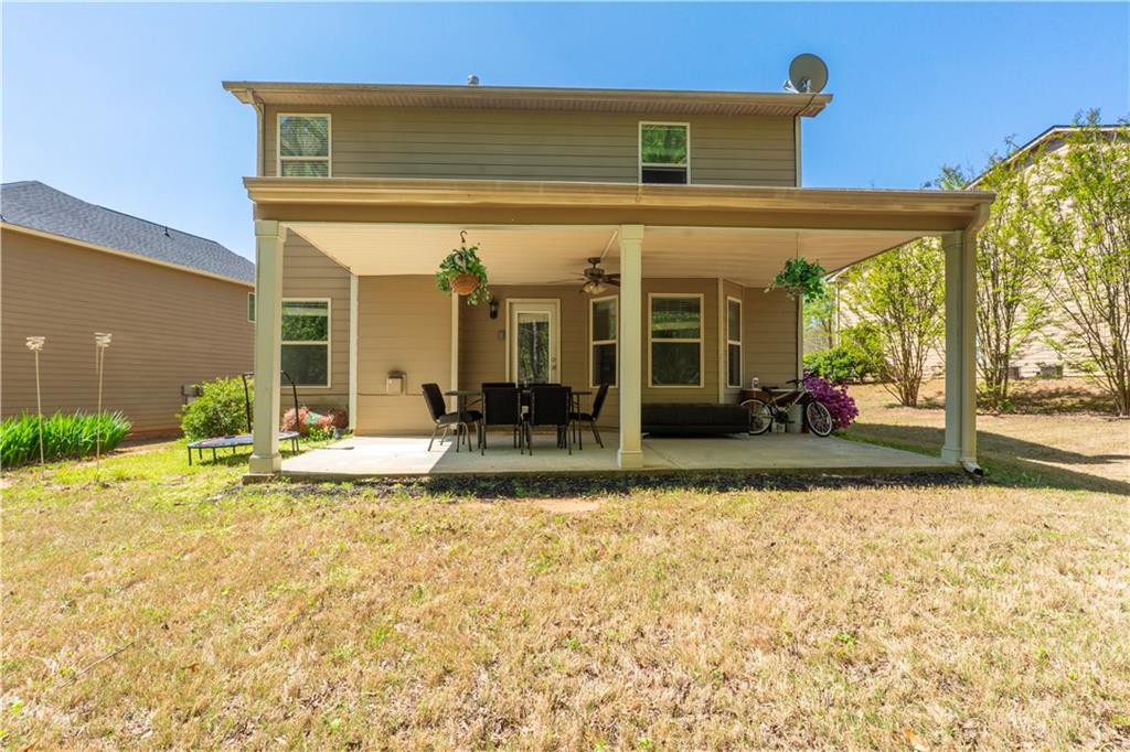 5555 Hedge Brook Drive Cumming, GA 30028 - Photo 14 of 15 a view of a house with patio