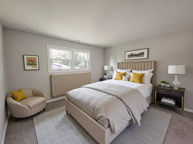 a bedroom with a bed and a couch