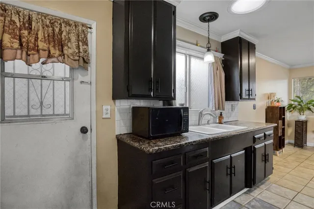 a living room with a flat screen tv and a fireplace