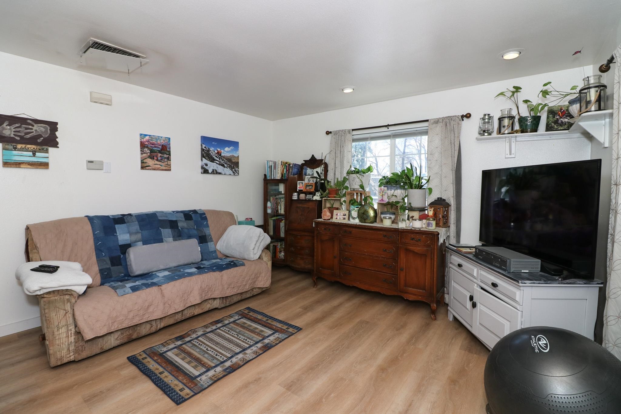 607-28 28 3/4 Road Grand Junction, CO 81506 - Photo 28 of 42 a living room with furniture and a flat screen tv