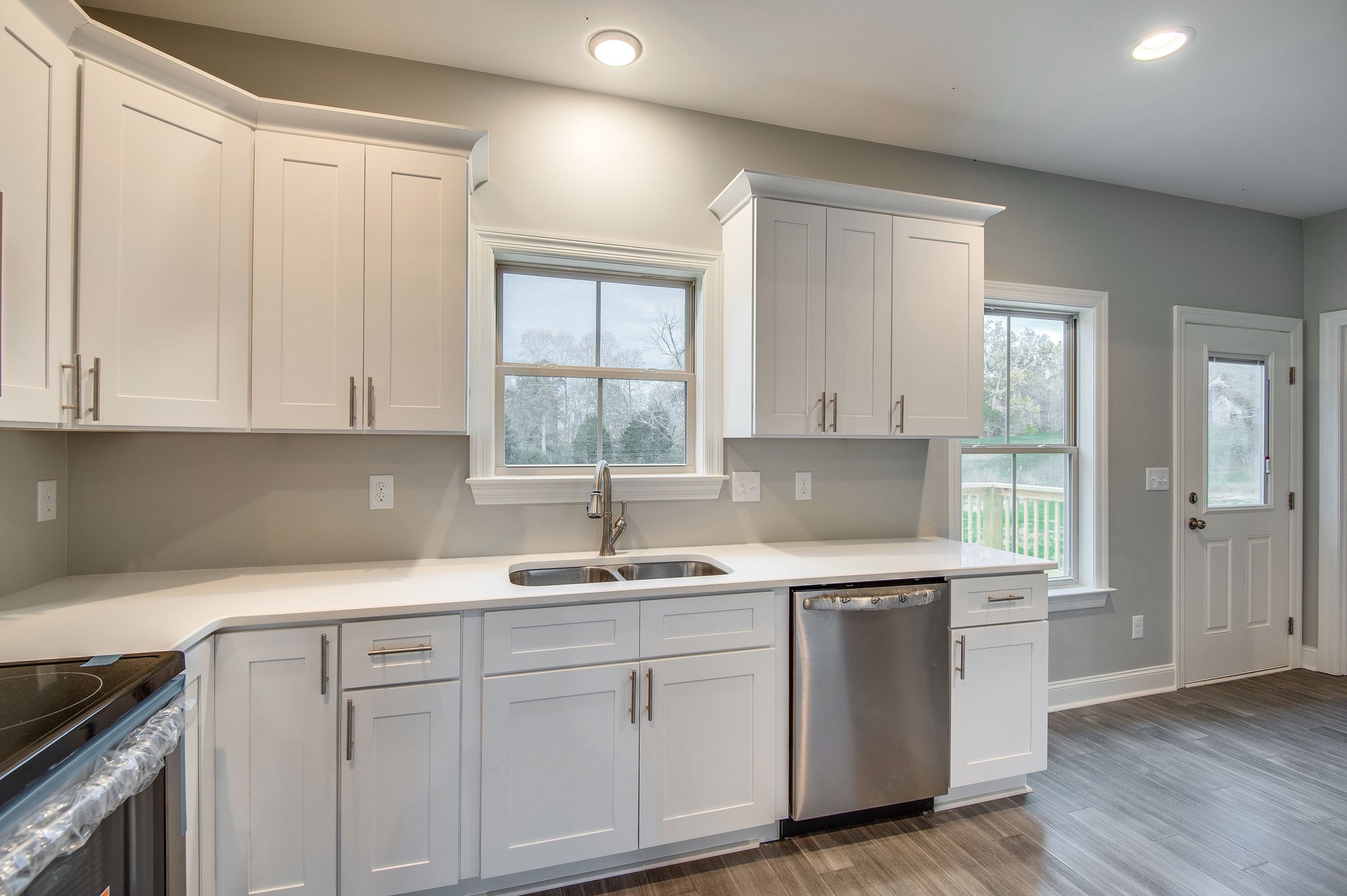 895 Goslin Branch Road Burns, TN 37029 - Photo 11 of 30 a kitchen with white cabinets and sink