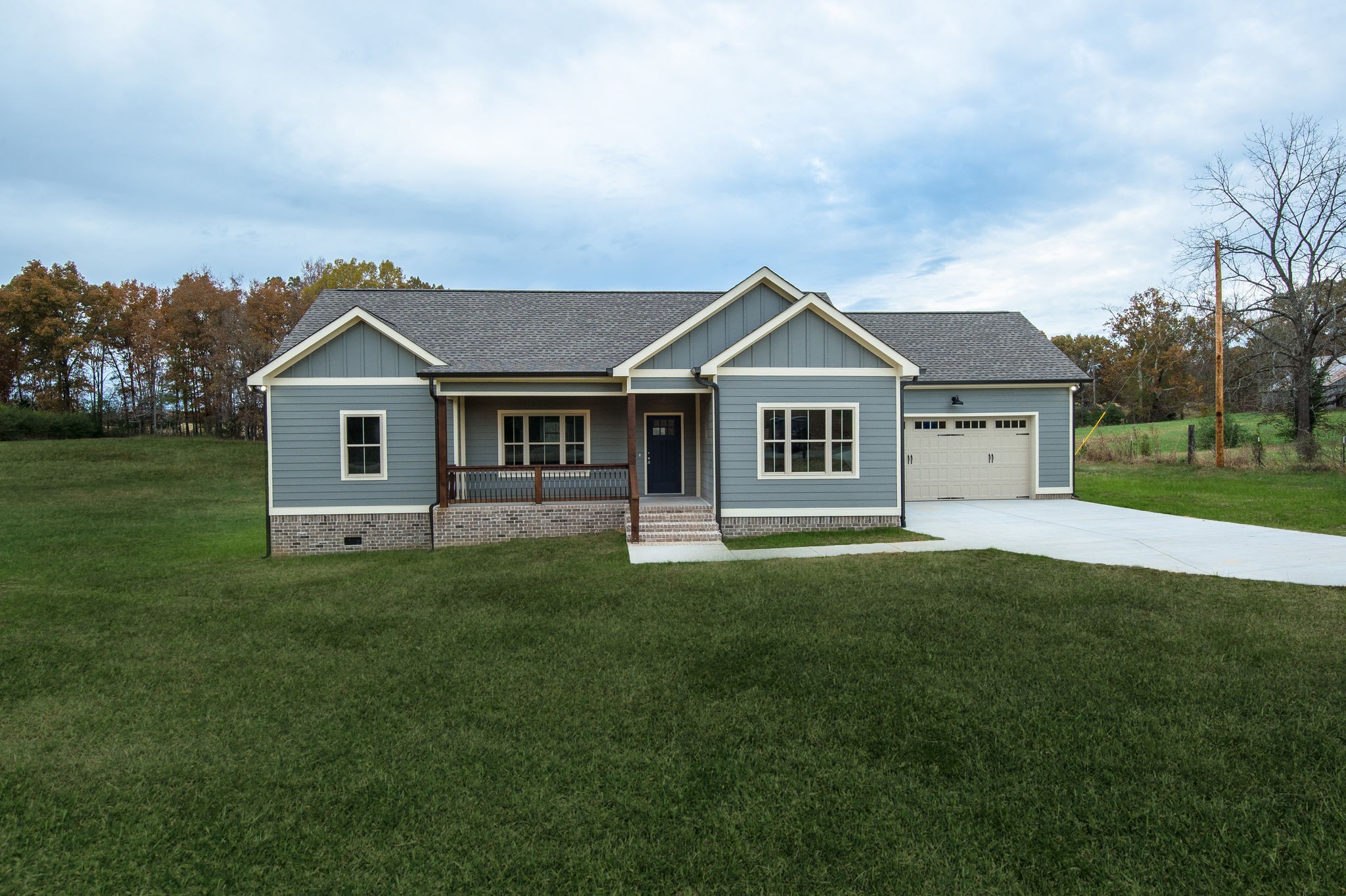895 Goslin Branch Road Burns, TN 37029 - Photo 20 of 30 a front view of a house with a garden