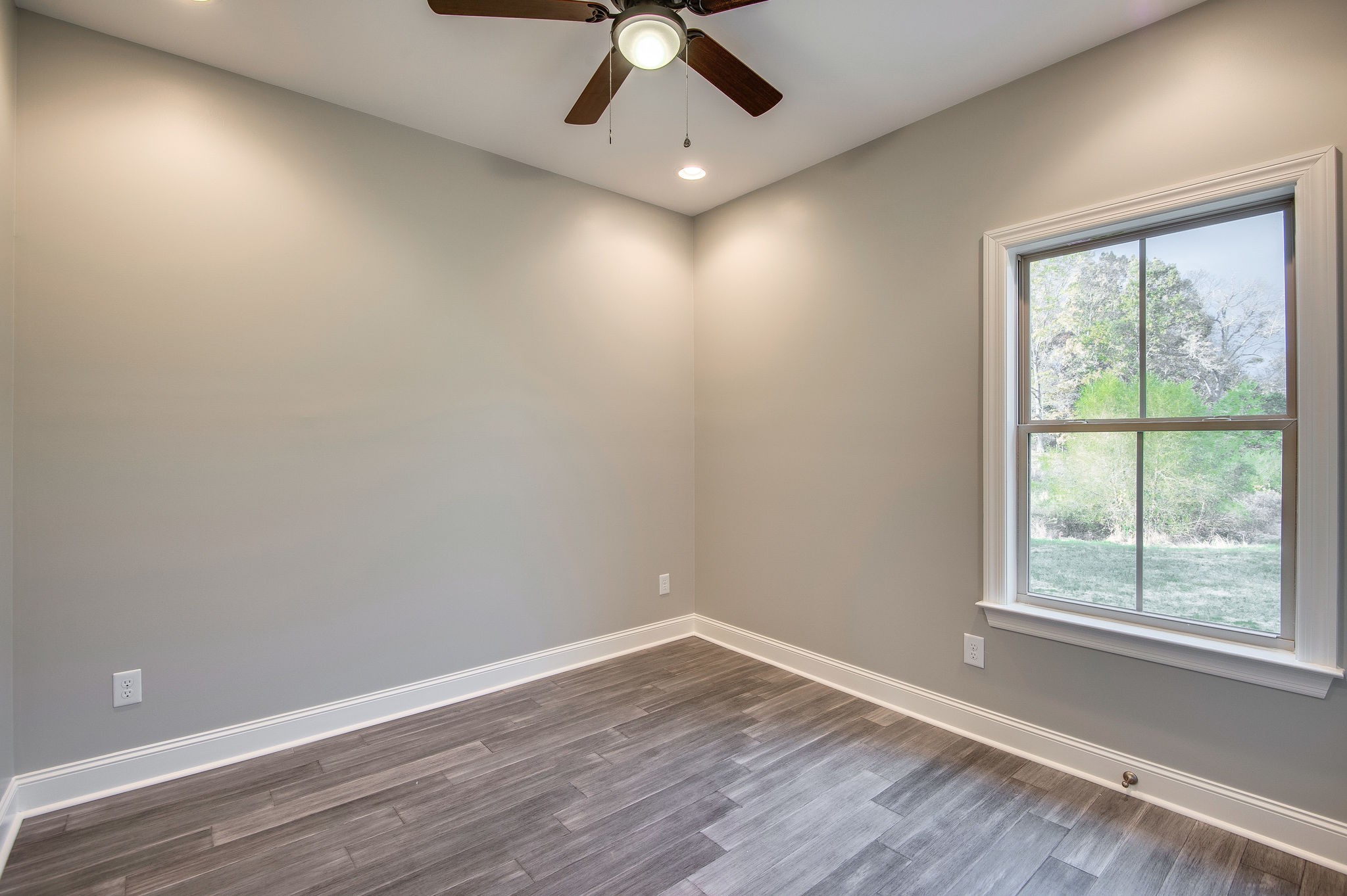 895 Goslin Branch Road Burns, TN 37029 - Photo 23 of 30 wooden floor in an empty room with a window