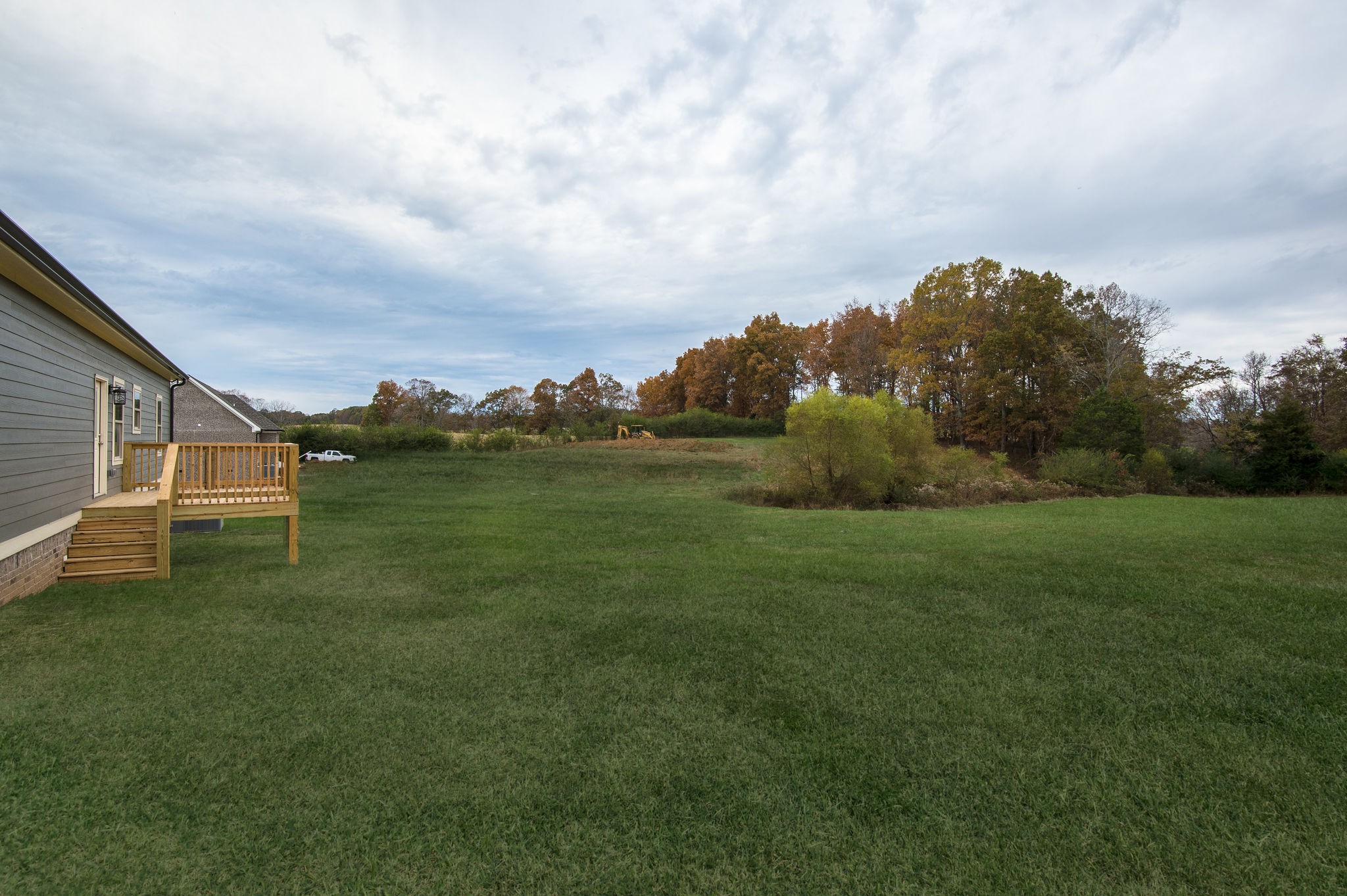 895 Goslin Branch Road Burns, TN 37029 - Photo 25 of 30 a backyard of a house with lots of green space