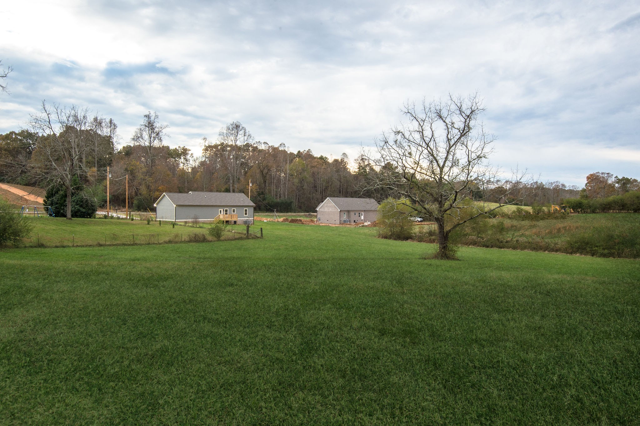 895 Goslin Branch Road Burns, TN 37029 - Photo 29 of 30 a view of a house with a big yard and a large trees