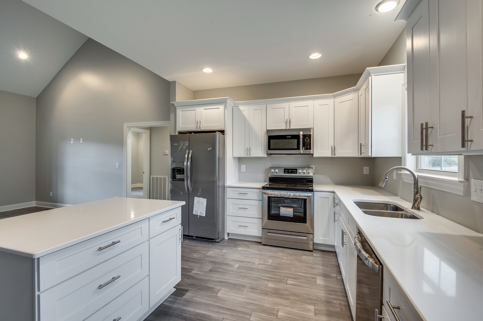 895 Goslin Branch Road Burns, TN 37029 - Photo 9 of 30 a kitchen with a sink stainless steel appliances and cabinets