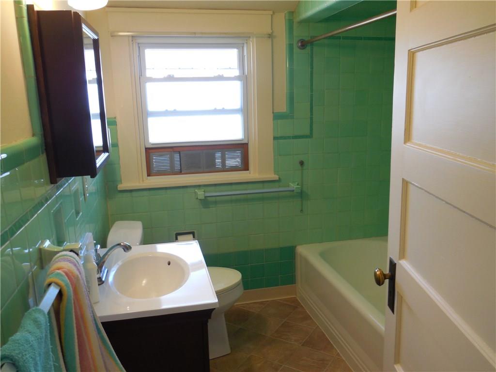 933 Indiana Avenue Monaca, PA 15061 - Photo 13 of 19 Main bathroom has been updated with new cabinetry, toilet and bath.