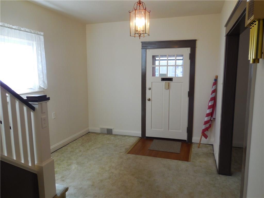 933 Indiana Avenue Monaca, PA 15061 - Photo 4 of 19 Large entrance. Natural hardwood is under this carpet.