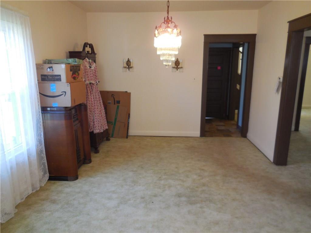 933 Indiana Avenue Monaca, PA 15061 - Photo 7 of 19 This oversized dining room will fit even the biggest family table and has working antique wall lights.
