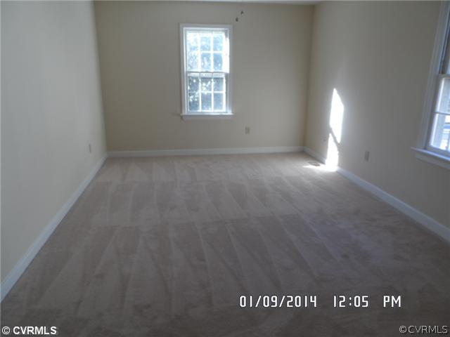 11124 Granada Road Richmond, VA 23235 - Photo 7 of 8 an empty room with windows
