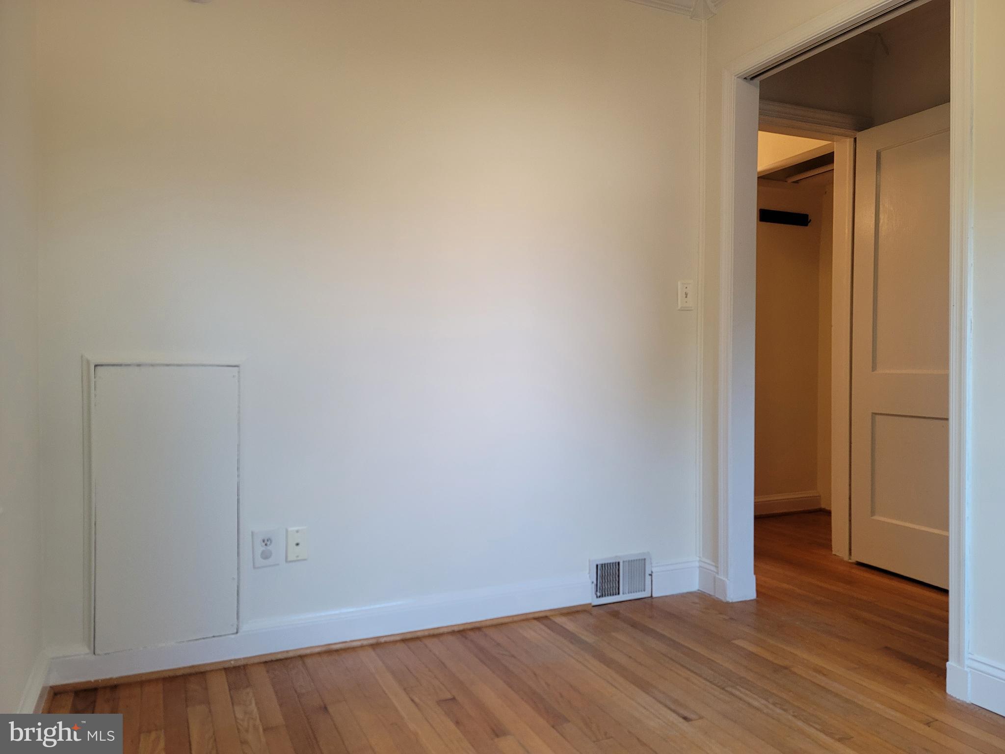 1015 Veirs Mill Road Rockville, MD 20851 - Photo 17 of 57 a view of an empty room with wooden floor and closet