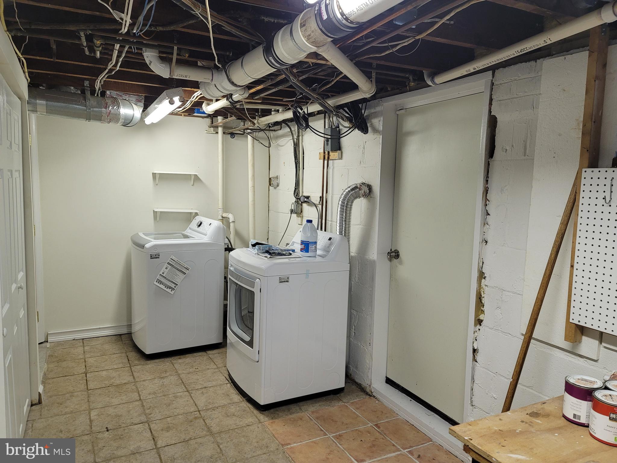 1015 Veirs Mill Road Rockville, MD 20851 - Photo 29 of 57 a utility room with dryer and washer