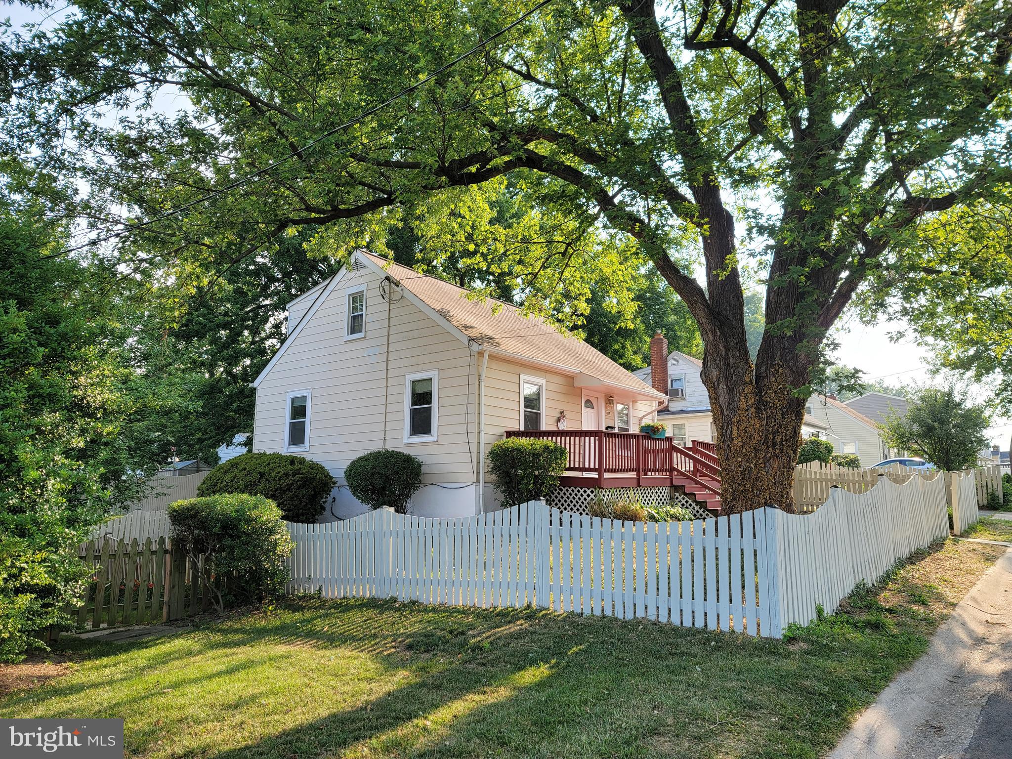1015 Veirs Mill Road Rockville, MD 20851 - Photo 3 of 57 a view of a house with backyard and a tree
