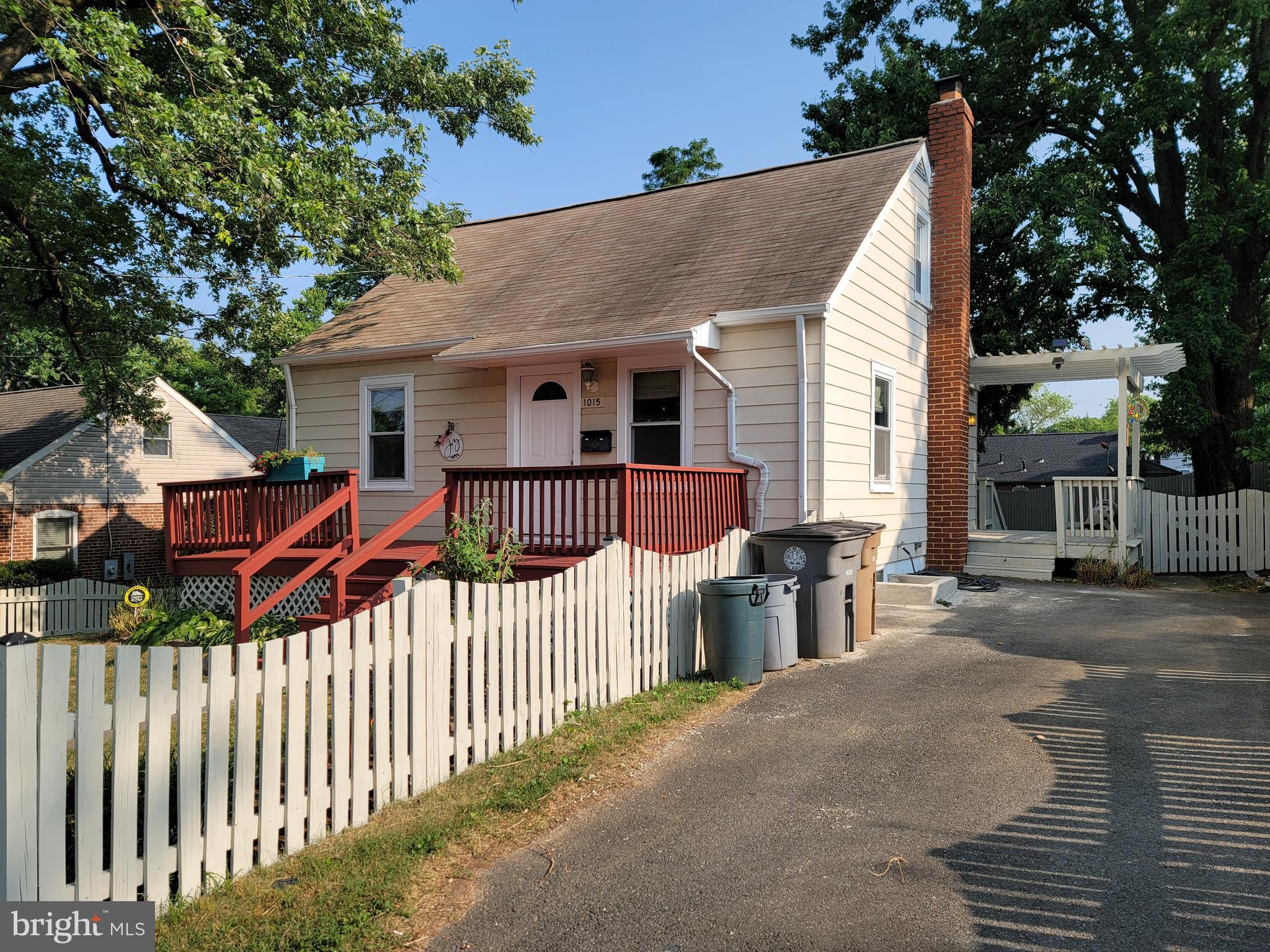 1015 Veirs Mill Road Rockville, MD 20851 - Photo 4 of 57 a view of a house with wooden fence next to a road