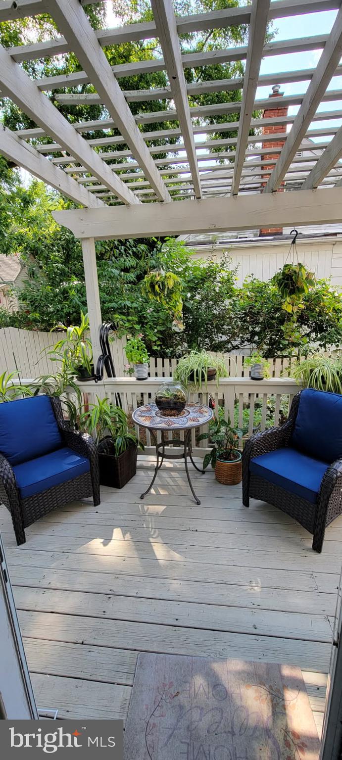 1015 Veirs Mill Road Rockville, MD 20851 - Photo 57 of 57 a outdoor space with lots of white furniture and plants
