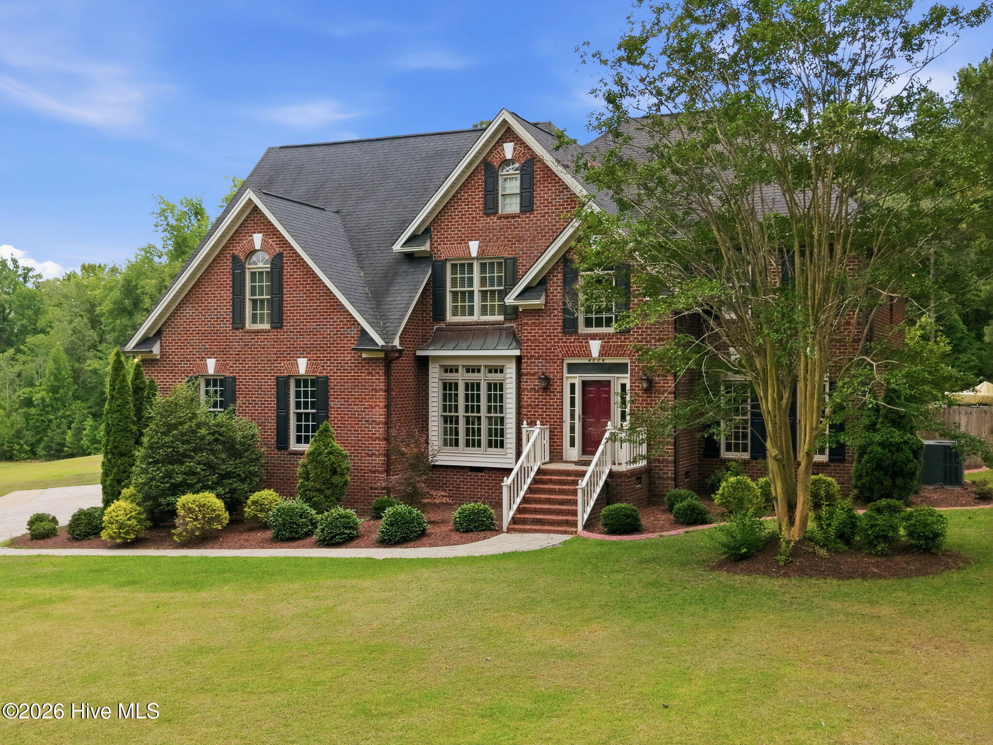 4076 Mobleys Bridge Road Grimesland, NC 27837 - Photo 3 of 66 front beautiful manicured lawn and landscaping