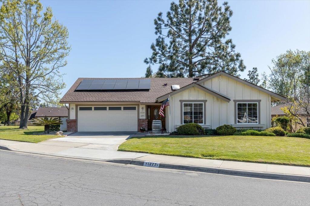 1277 La Casa Drive San Marcos, CA 92078 - Photo 2 of 29 a house that has a tree in front of it