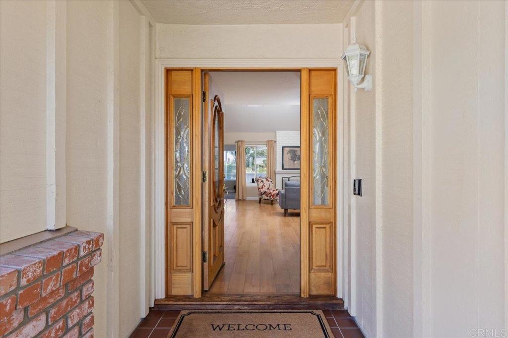 1277 La Casa Drive San Marcos, CA 92078 - Photo 6 of 29 hallway with view of living room and wooden floor
