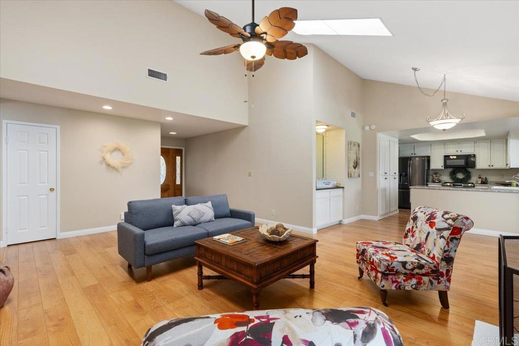 1277 La Casa Drive San Marcos, CA 92078 - Photo 9 of 29 a living room with furniture kitchen view and a chandelier