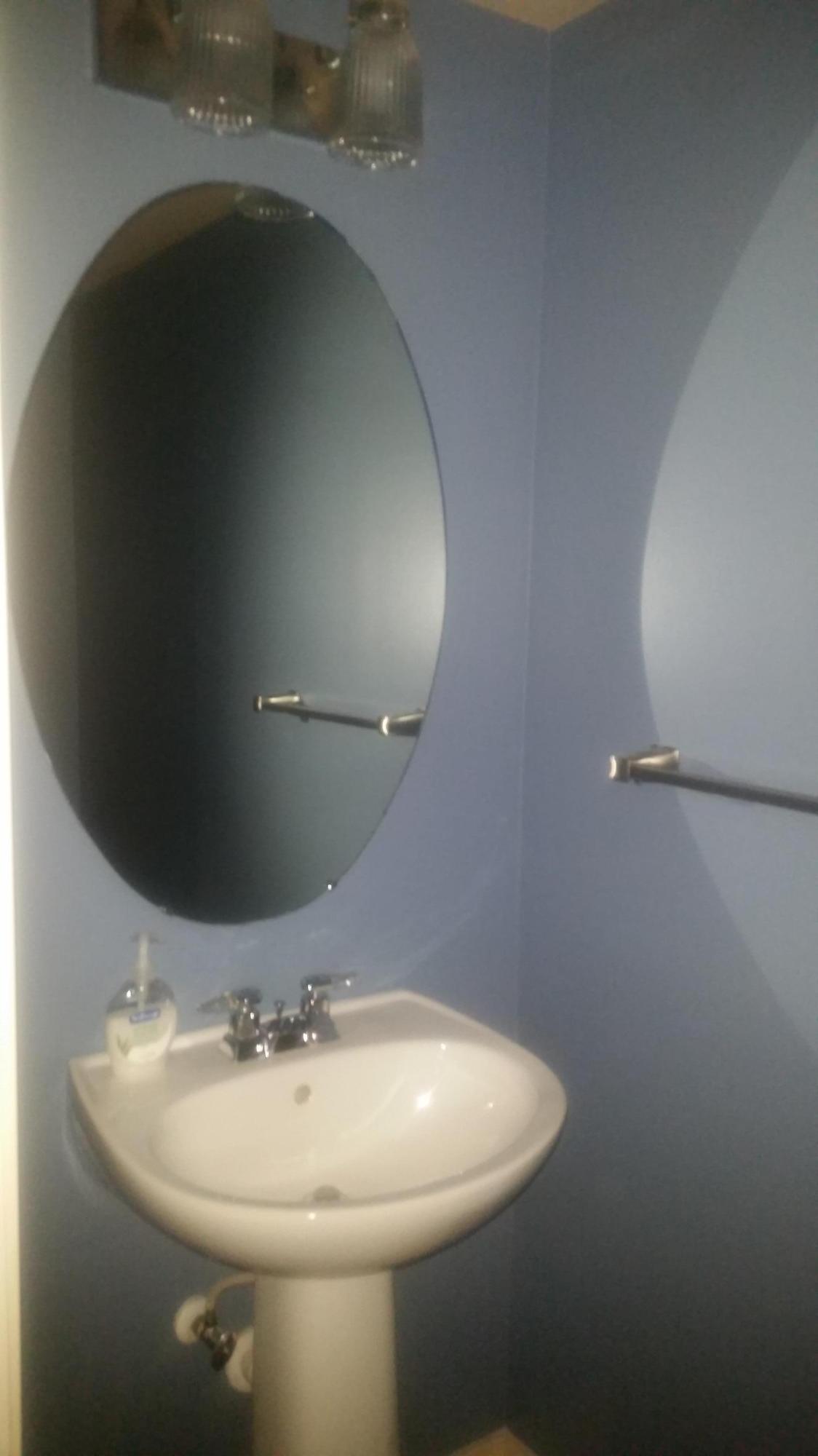 1004 Kokomo Key Lane Delray Beach, FL 33483 - Photo 11 of 21 a bathroom with a sink and mirror
